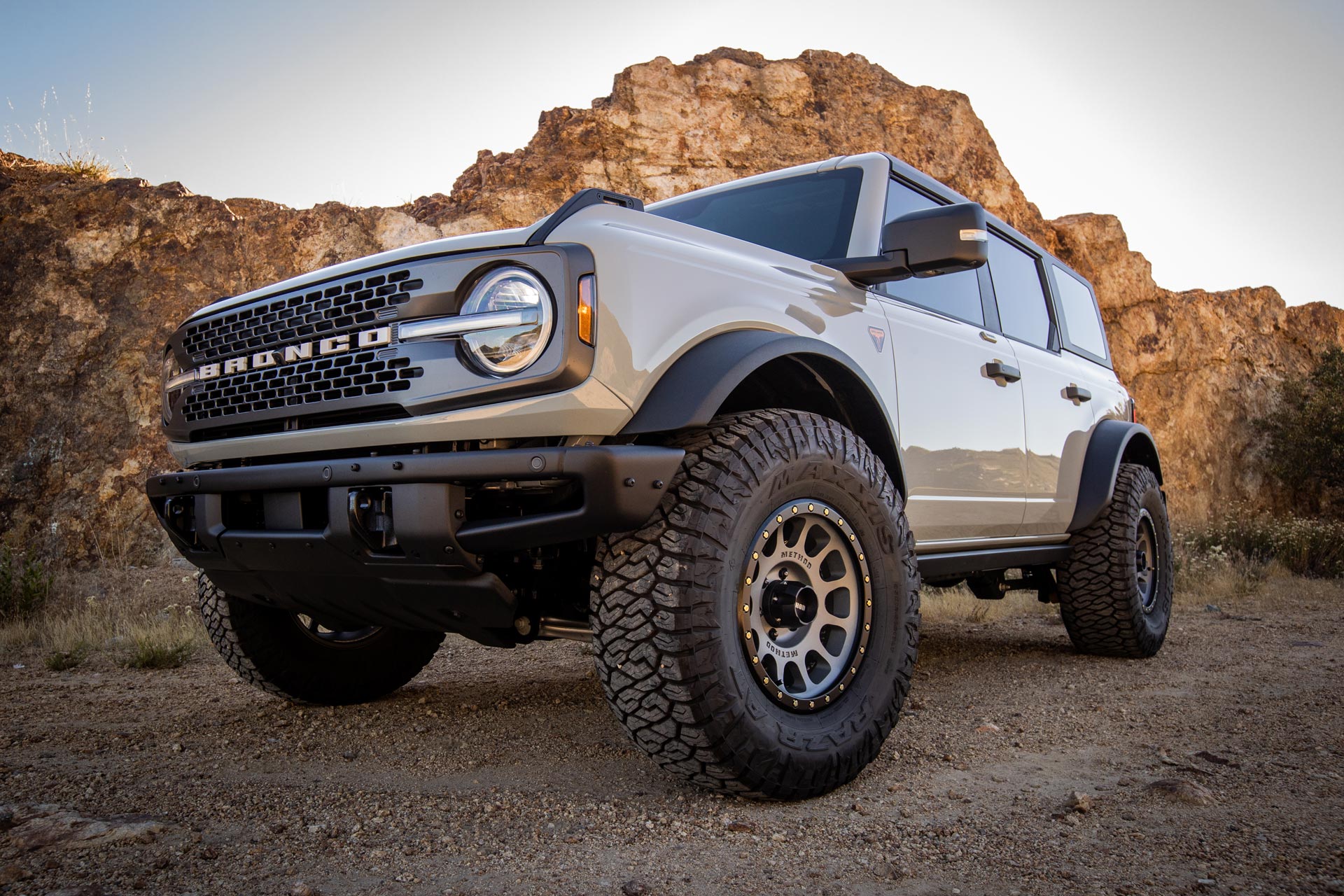 New Ford Bronco on a dirt trail with Maxxis RAZR AT tires.