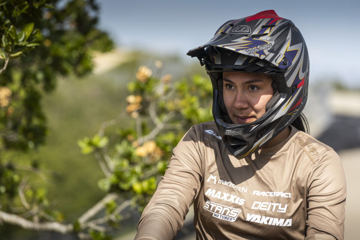 Maxxis Bike athlete smiling with helmet on.