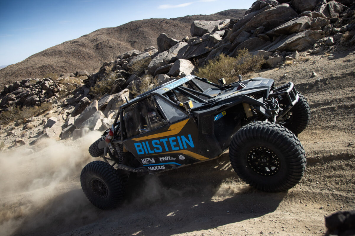 Mittag with the pedal to the floor sprinting up on of the hills of Johnson valley.